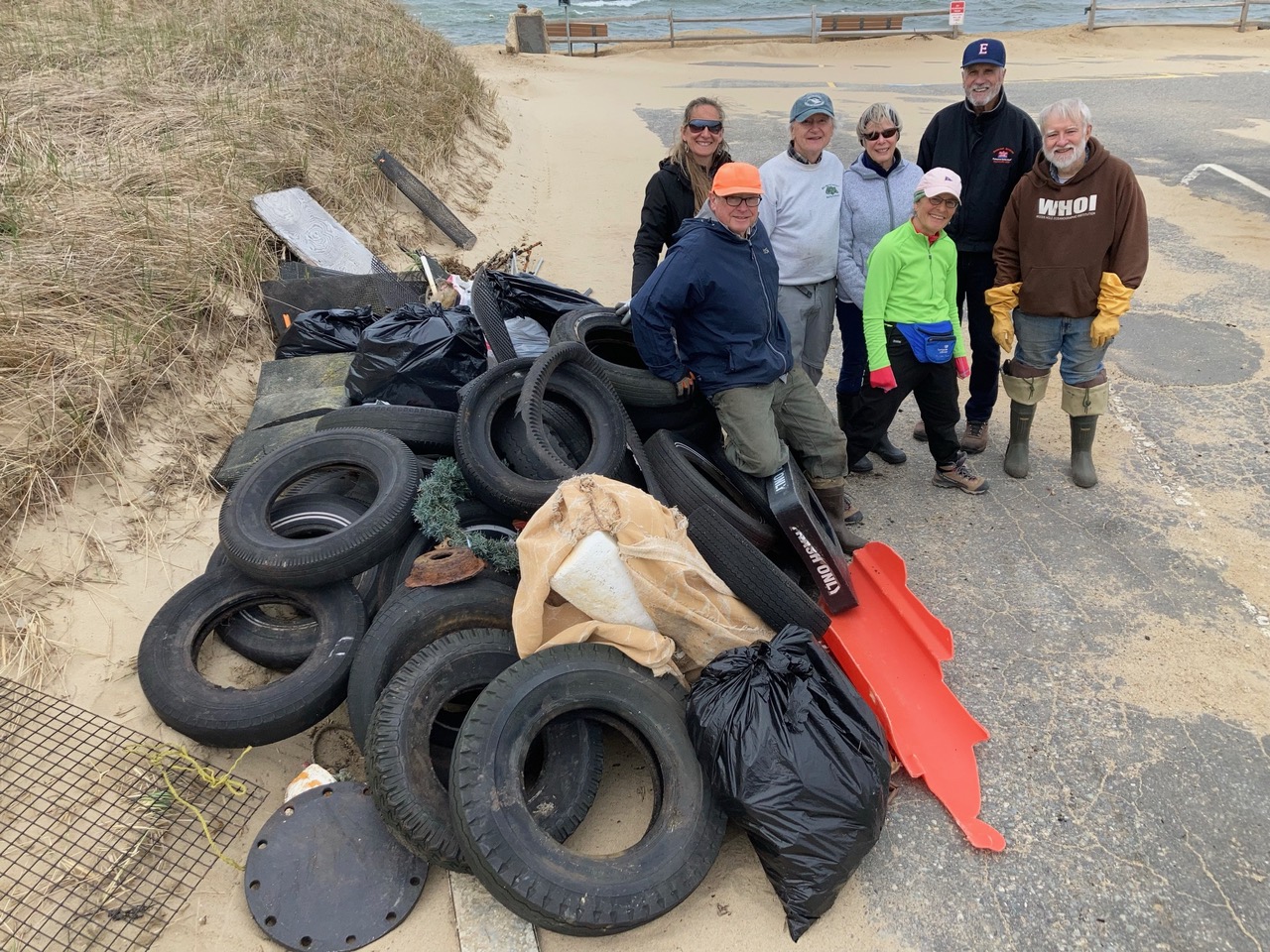 The collected debris and the helpsers assembled